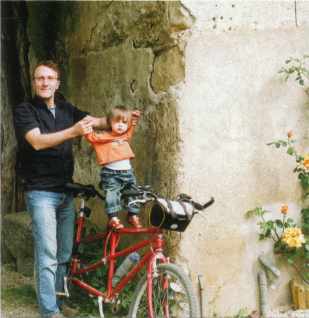 Jonathan gives Louis his first cycling lesson on a canalside tandem.